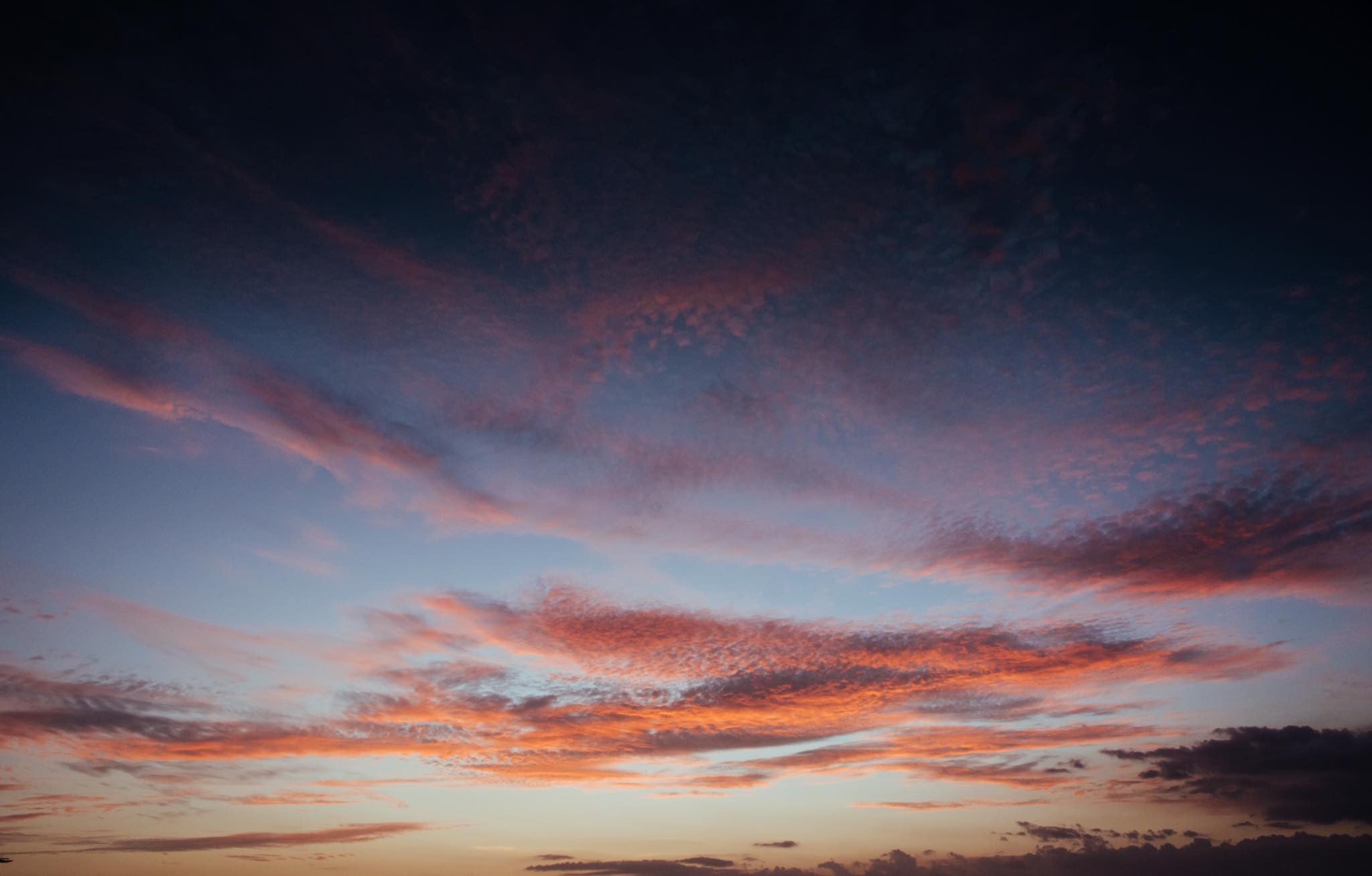 Gorgeous magenta cloud sunset in Tamarindo, Costa Rica. Photographed by Kristen M. Brown, Samba to the Sea. Sunset print available at The Sunset Shop.