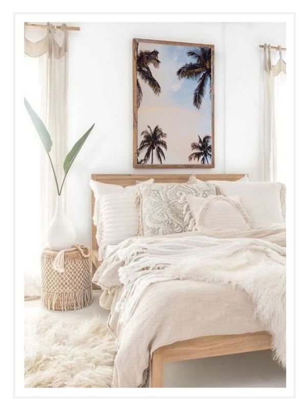 Dreamy beachy boho bedroom with breathtaking photography print of rainbow in between palm trees with a sunrise sky in Miami Florida. "Palmbow" photo print by Kristen M. Brown of Samba to the Sea, available at The Sunset Shop.