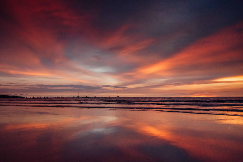 Gorgeous pink sunset reflections off the sand in Tamarindo Costa Rica. Photographed by Kristen M. Brown, Samba to the Sea for The Sunset Shop.