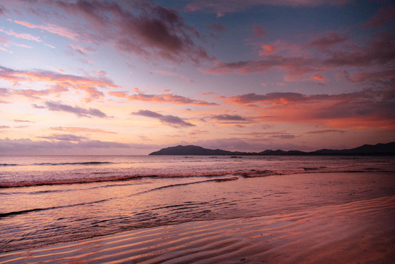 Pastel sunset in Tamarindo Costa Rica. Photographed by Kristen M. Brown, Samba to the Sea for The Sunset Shop.