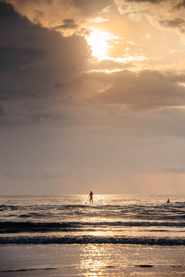 Stand Up Paddle boarding at sunset in Tamarindo, Costa Rica.Photographed by Kristen M. Brown, Samba to the Sea at The Sunset Shop.