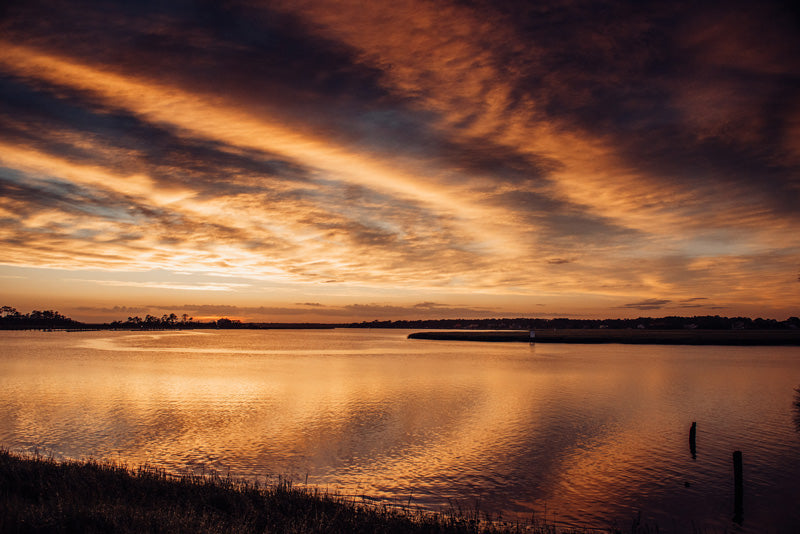 Sunset over Moon River in Savannah Georgia. Photographed by Kristen M. Brown, Samba to the Sea for The Sunset Shop.