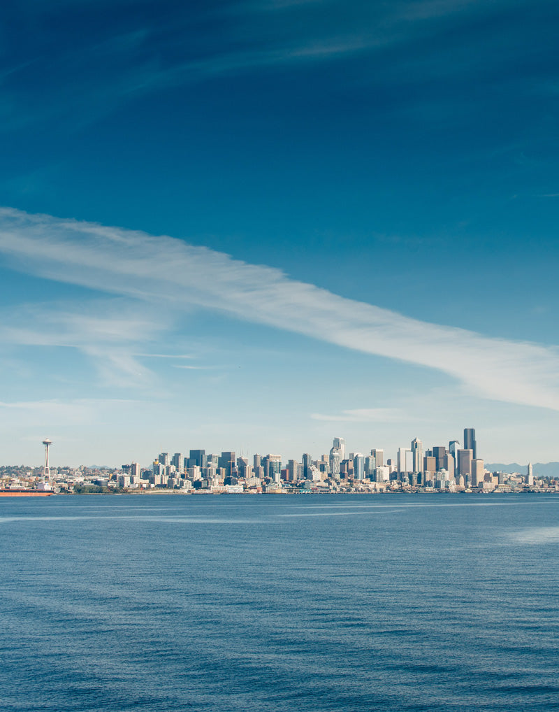 Blue skies Seattle Washington Skyline. Photographed by Kristen M. Brown, Samba to the Sea for The Sunset Shop.