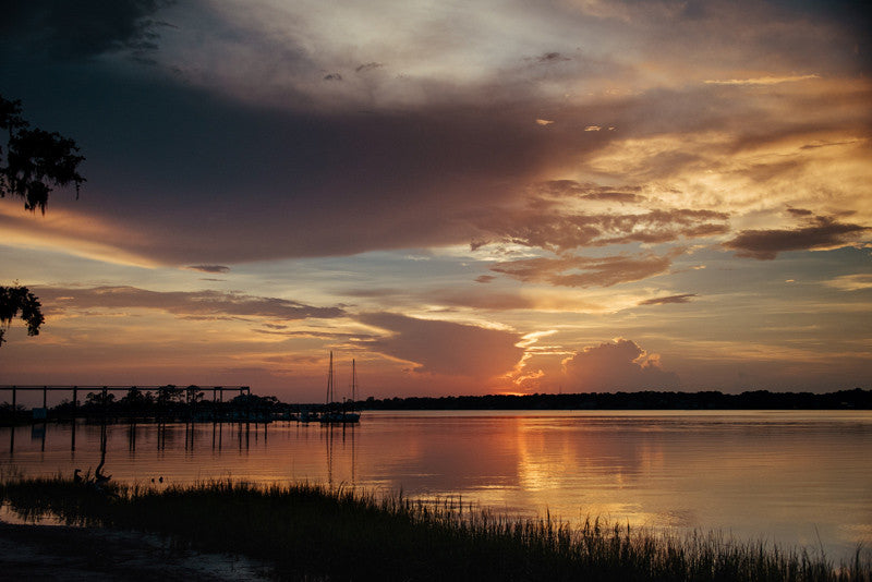 Savannah Georgia sunset over Moon River at South Harbor on Skidaway Island. Photographed by Kristen M. Brown, Samba to the Sea. 