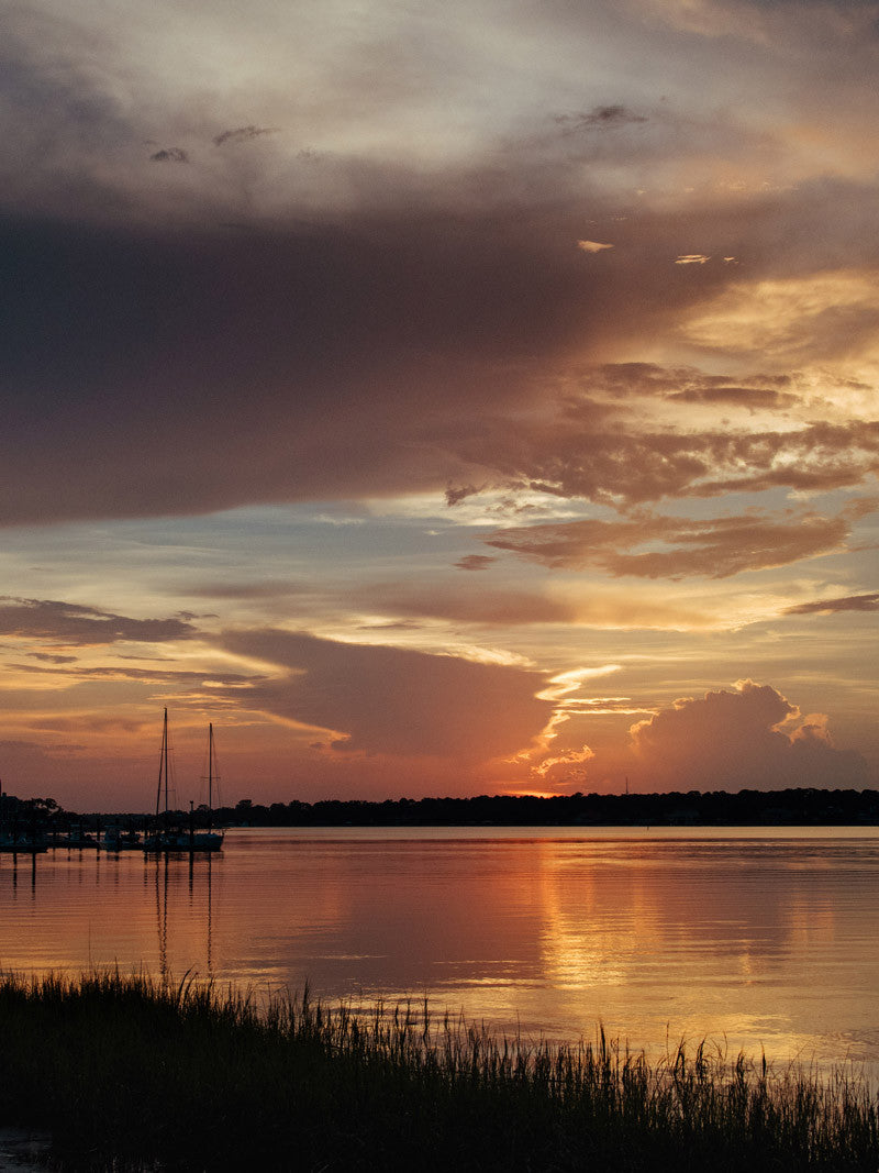 Savannah Georgia sunset over Moon River at South Harbor on Skidaway Island. Photographed by Kristen M. Brown, Samba to the Sea. 