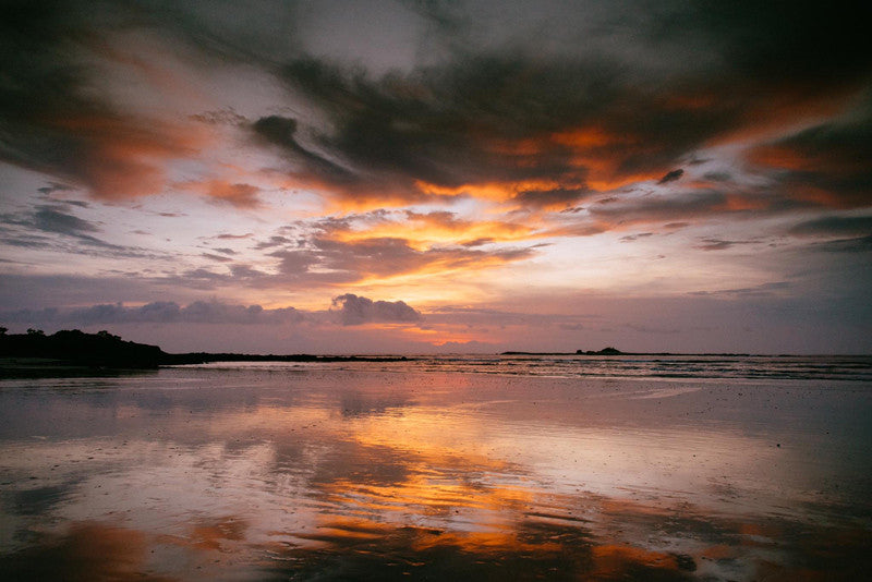 Sunset reflections on the beach in Tamarindo Costa Rica. Photographed by Kristen M. Brown, Samba to the Sea for The Sunset Shop.