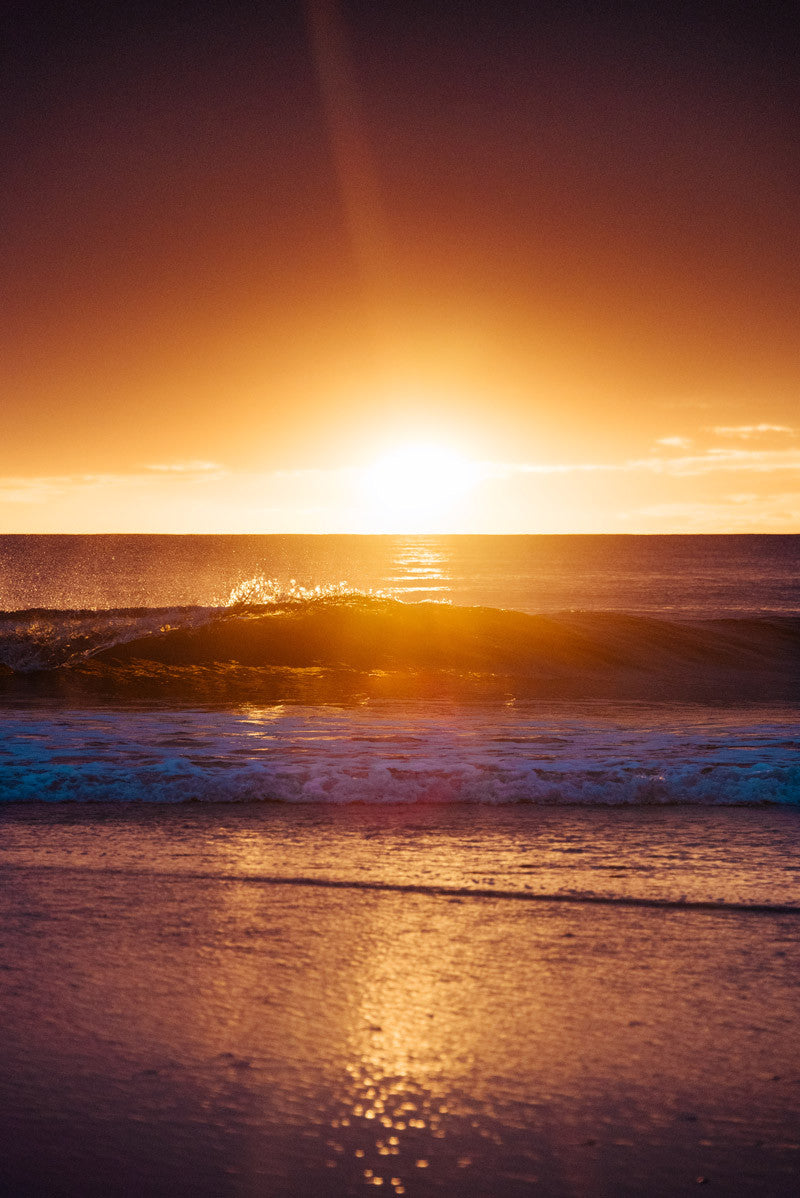 Golden waves at sunset in Tamarindo Costa Rica. Photographed by Samba to the Sea.