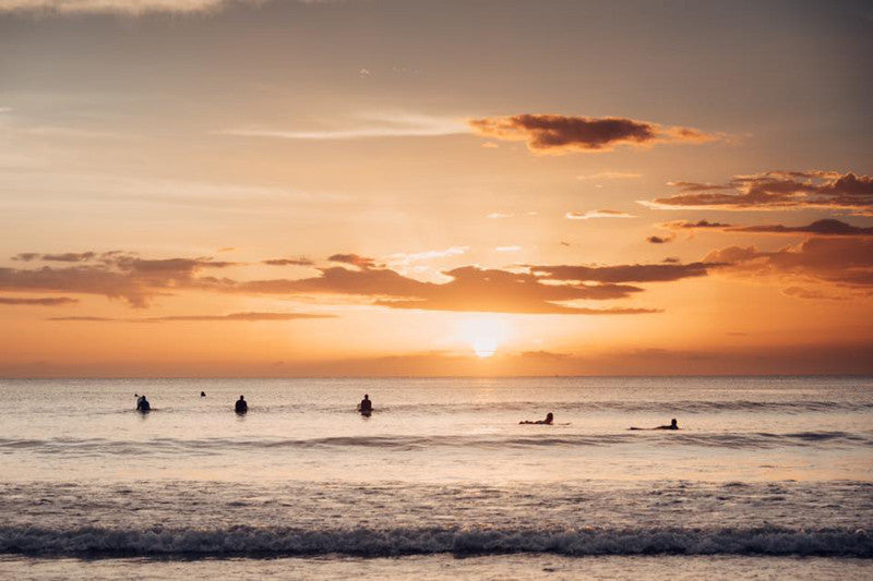 Surfers at sunset in Tamarindo Costa Rica. Photographed by Kristen M. Brown Samba to the Sea.