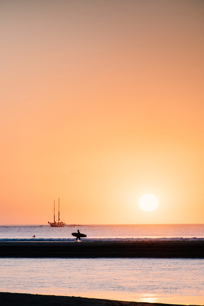 Sunset surfer in Tamarindo Costa Rica. Surfer art pictures photographed by Kristen M. Brown, Samba to the Sea for The Sunset Shop.