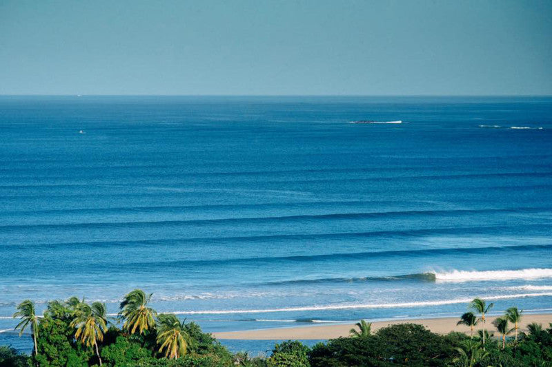 Breaking right wave in Tamarindo Costa Rica. Corduroy lines in Costa Rica. Photographed by Kristen M. Brown, Samba to the Sea.