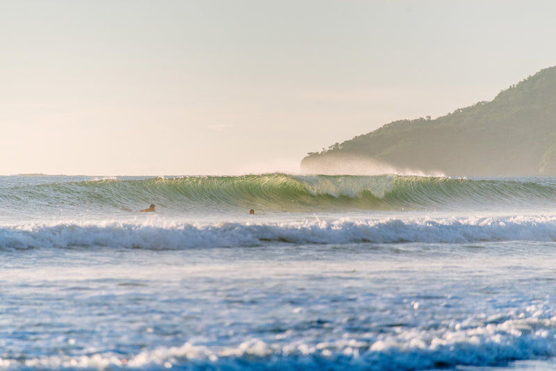 Backlit turquoise wave breaking in Tamarindo Costa Rica. Photographed by Kristen M. Brown, Samba to the Sea for The Sunset Shop.