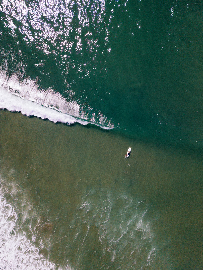 Aerial image of wave breaking in Waddell Beach California. Photographed by Kristen M. Brown, Samba to the Sea for The Sunset Shop.
