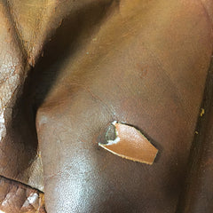 Repairing holes in leather