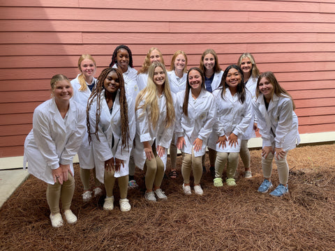 Students from the biosynthetic course. A group of happy girls in their lab coats, ready to practice bioart and learn some biotechnology !