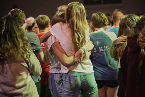 two kids hugging