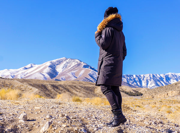 hike a mountain in a heated coat