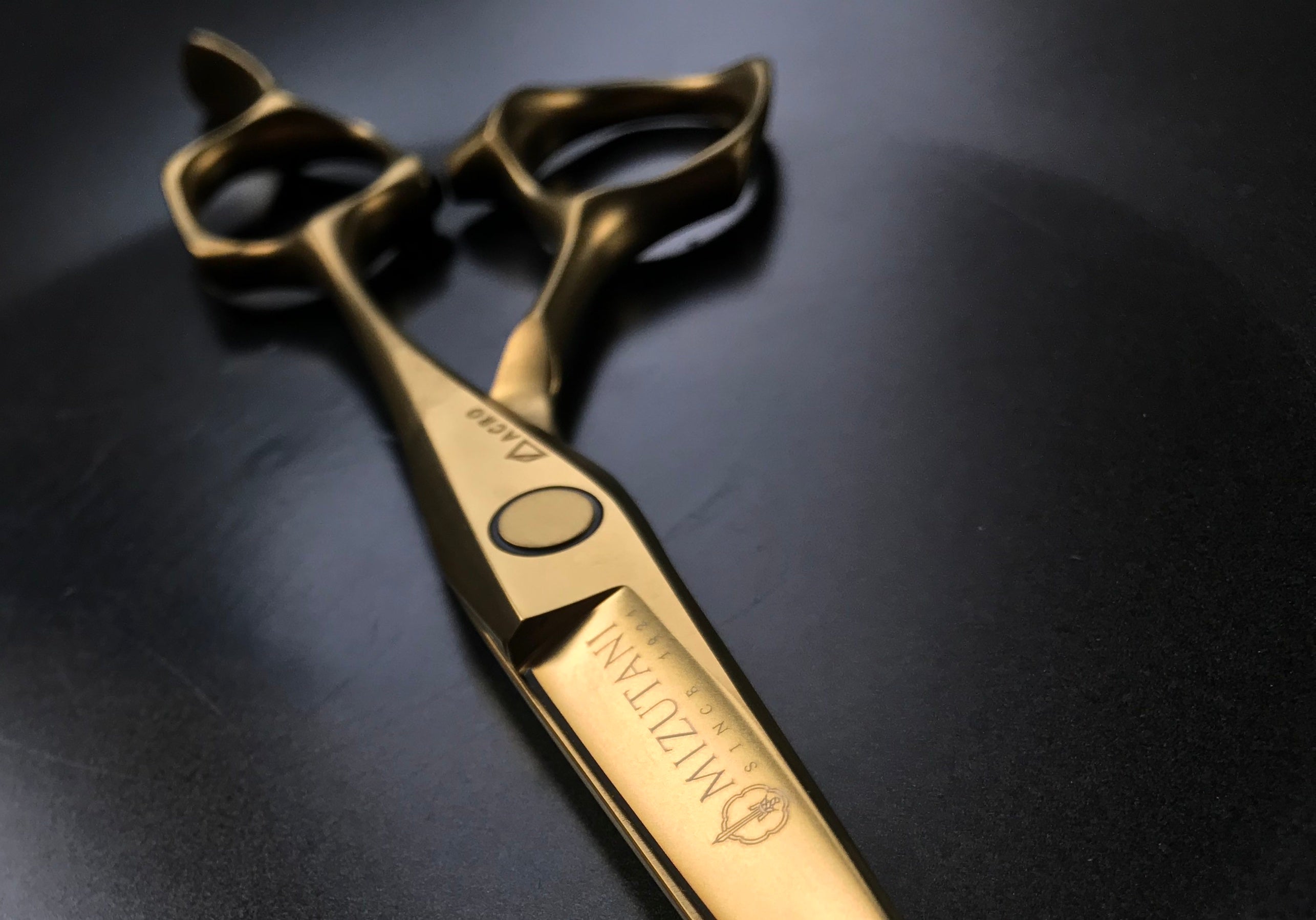 Gold Mizutani Scissors Canada with dark background