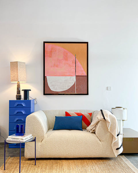 Boucle cream vint couch love seat with bright blue chest of drawers and framed artwork Roseate Hues from HKliving