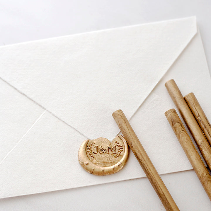 Gold Glue Gun Sealing Wax Sticks Lying On Back Of Envelope With Monogram Wax Seal | How To Use A Wax Seal Stamp With A Glue Gun | Heirloom Seals