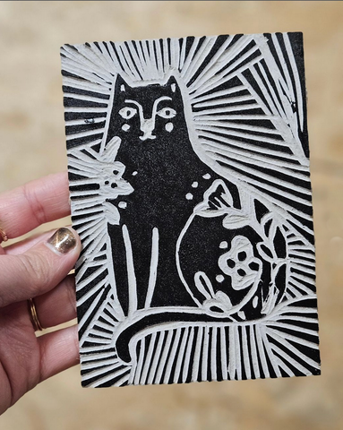 lino cut print of a cat