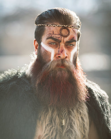 man with beard and face paint by Amin Mlk on Unsplash.com