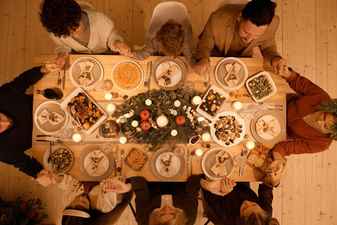 Family gathered at holiday table by Nicole Michalou on Pexels.com