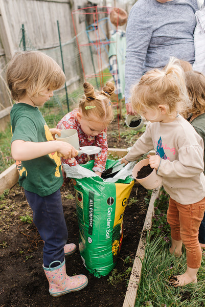 Kids planting gardening