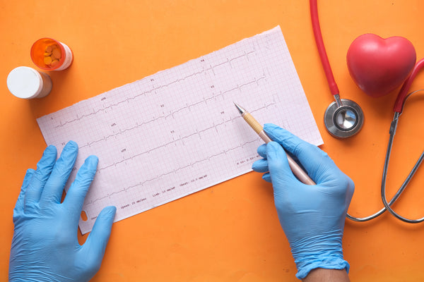 Doctor Checking Heartbeat Record