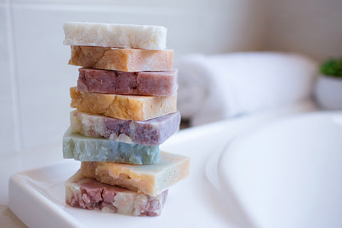 Soap bars beside bath