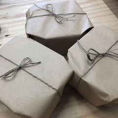 Gifts wrapped in kraft paper and twine