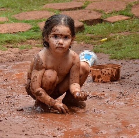 Child with muddy face