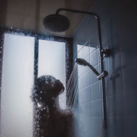 Lady in shower cubicle