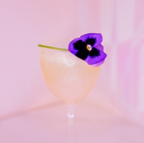 Cocktail with flower on glass