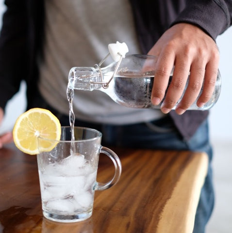 Pouring water into a glass