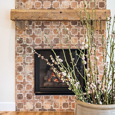 Arabesque Tangier Cement Tiles in a blend of colors and textures provide a rustic look to this hearth.