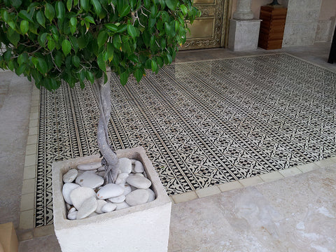 Black and White Yuna Border Tiles in Rows Create a Unique Dining Patio