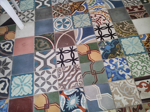 Bold, playful and colorful cement tile patchwork on a floor