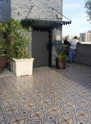 The outside terrace at Perch in Los Angeles, CA uses cement tiles