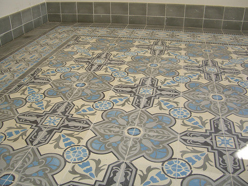Rich colors and intricate patterns of Cuban cement tile floor. Shown: Cuban Heritage Design 110 2B with grey bull-nosed trim