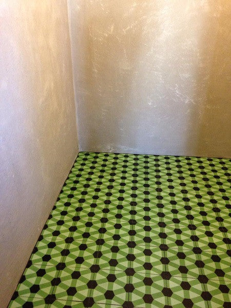 A bold geometric encaustic cement tile pattern for the restaurant's lavatory.