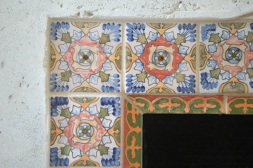 Hand painted Spanish tiles create a rustic look