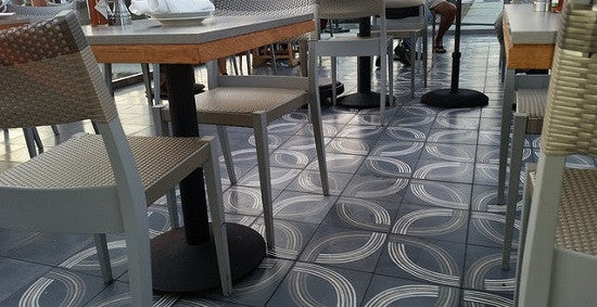 The patio floor at Bluewater Grill uses cement tile to create a casual, relaxed space