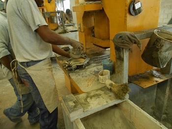 Two layers of concrete and sand are poured on top of the color layer