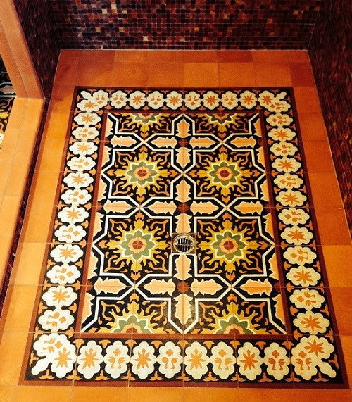 Warm colors for this cement tile rug make for a stunning walk in shower for the master bath