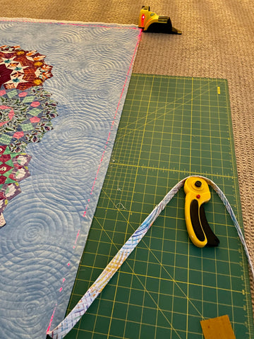 Trimming the edge of the quilt