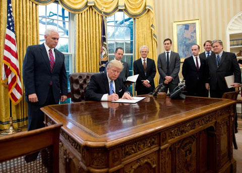 Donald Trump signing global gag rule https://28moons4s4w.com