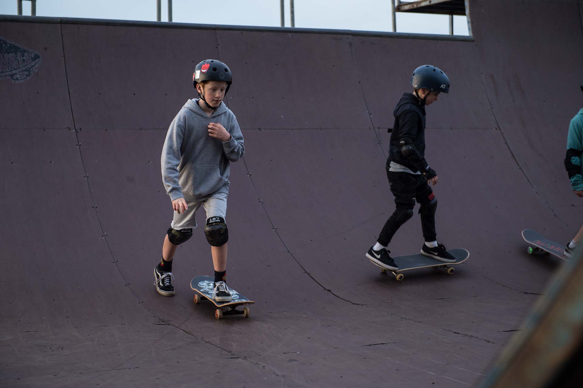 Skate students in a lesson on our outdoor halfpipe at Rampfest Indoor Skatepark