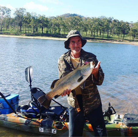 a fisher man on shallow water fishing