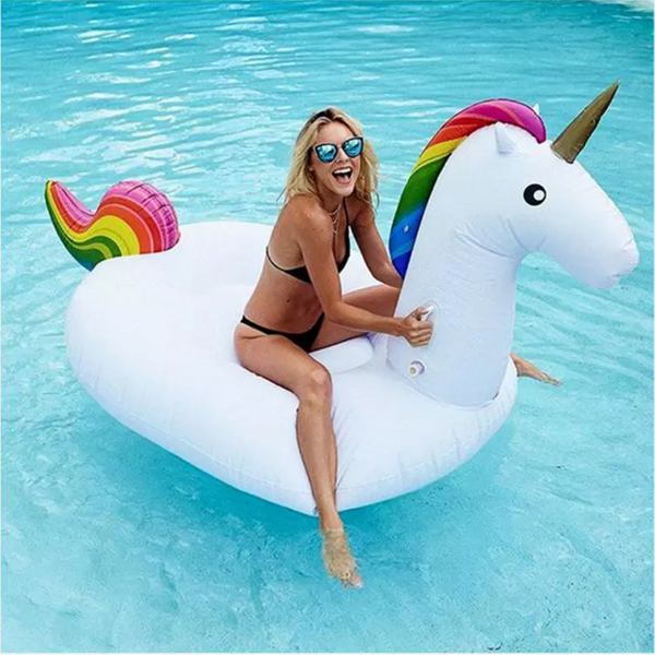 Inflatable Unicorn Pool Toy with Girl wearing Glasses in Pool