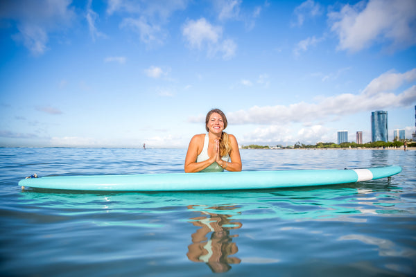 sup yoga in the ocean